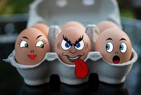 Three eggs with funny faces. 库存照片