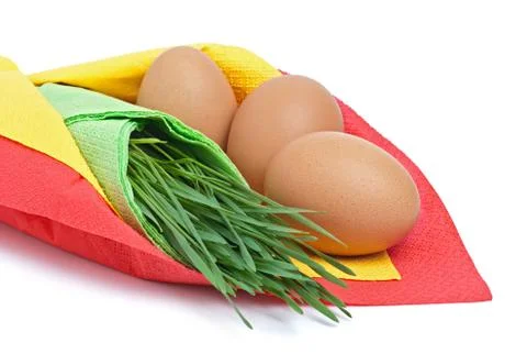 Three eggs with green grass Stock Photos