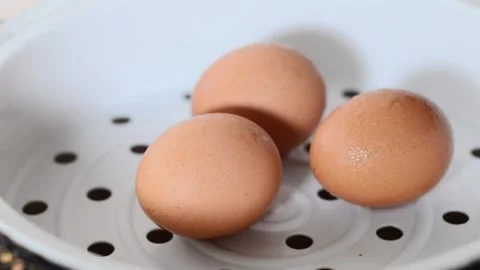 Three eggs steamed in a multicooker, close-up Video stock 170610522