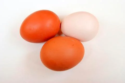 Three eggs on white background Stock Photos