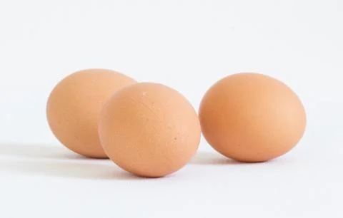 Three eggs on white background Stock Photos
