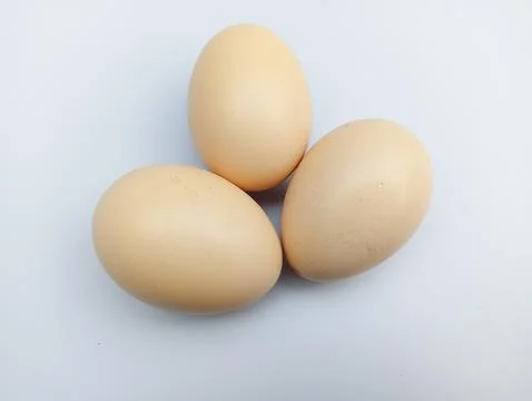 Three eggs on white background  Stock Photos