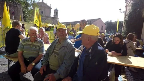 Three elderly men sitting with yellow hats Stock Footage 118836286
