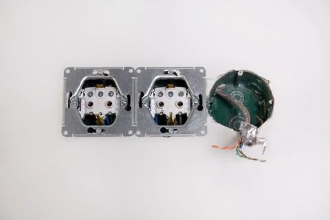 Three electrical boxes for conduits are built into the wall. Work on instal.. Stock-Fotos