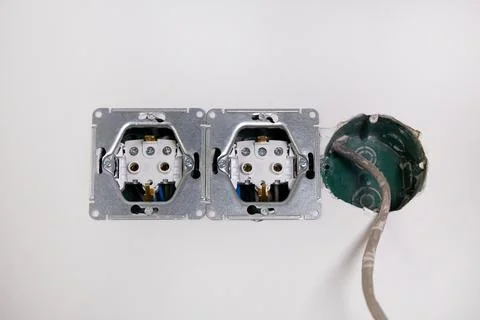 Three electrical boxes for conduits are built into the wall. Work on instal.. Stock Photos