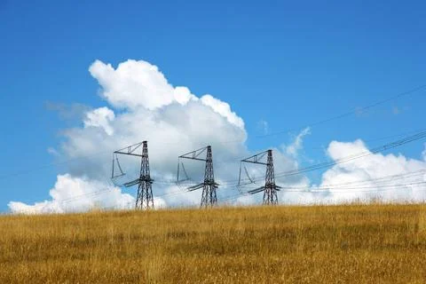 Three electrical towers Three electrical towers background of clouds and s... Foto stock