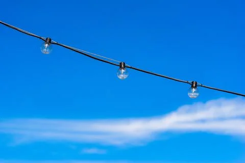 Three electrolamps on a wire Stock Photos