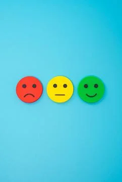Three emoji faces representing sad, indifferent and happy. Concept for custom Stock Photos