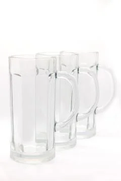 Three empty beer mugs with handles on a white background Stock Photos