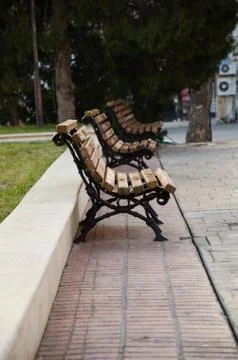 Three empty benches in the park Stock Photos