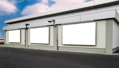 Three empty billboards on a building Stock Photos