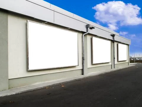 Three empty billboards on a building Foto stock