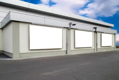 Three empty billboards on a building Stock Photos