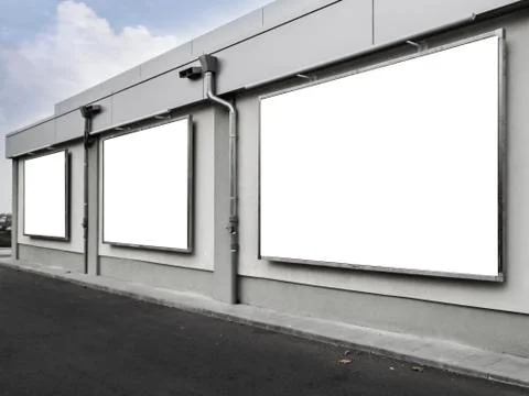 Three empty billboards on a building Stock Photos