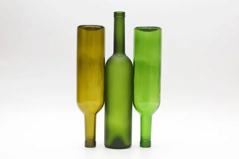 Three empty bottles of wine on white background Stock Photos