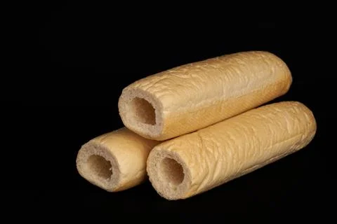 Three empty buns isolated on black background Stock-Fotos