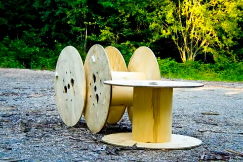 Three empty cable drums discarded in a Bavaria forest of Deutschland Stock Photos