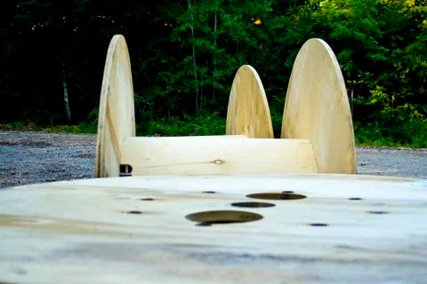 Three empty cable drums discarded in a Bavaria forest of Deutschland Stock Photos