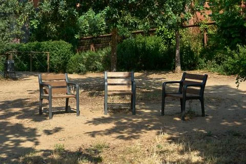 Three empty chairs in park Stock Photos