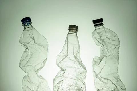 Three empty clear wet plastic bottles Stock Photos