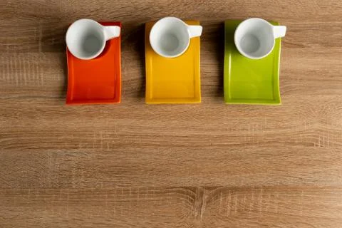 Three empty cups of coffee on desk up center close-up Stock Photos
