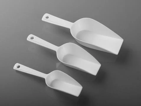 Three empty plastic scoops Stock Photos