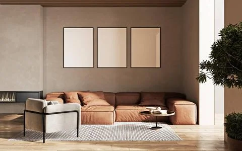 Three empty poster frames on beige wall in living room interior with moder... Stock Photos