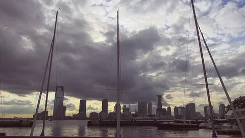Three Empty Sailing Masts Bobbing in Wind at Sunset Stock Footage 76949131