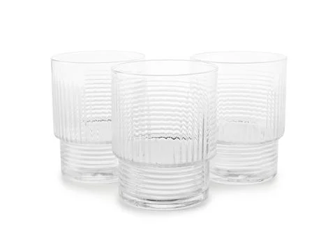 Three empty textured drinking glasses on white background Stock Photos
