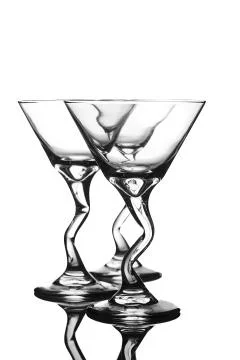 Three empty transparent glass on a light background Stock Photos