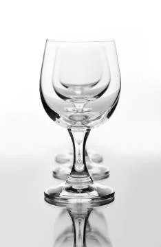 Three empty wine glasses in a row Stock Photos