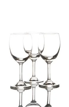 Three empty wine glasses on white background Stock Photos