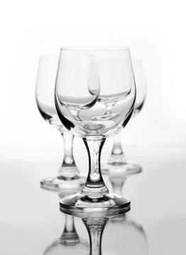 Three empty wine glasses on white Stock Photos