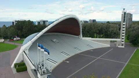 Three Estonian flags waving in front of Tallinn Song Festival Grounds Stock Footage 139113951