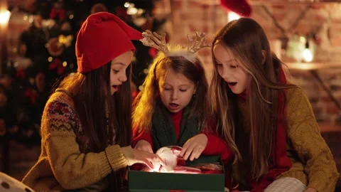 Three exited, Extremely Happy Sisters, Friends are opening, unpacking. Stock Footage 144793642
