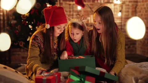 Three exited, Extremely Happy Sisters, Friends are opening, unpacking. Video stock 144793716