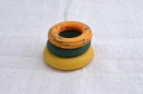 Three expander isolated on a white background in different colors Stock Photos