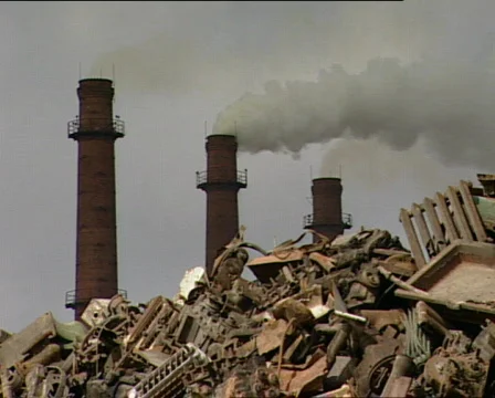 Three factory chimneys and scrap metal Stock Footage 299067