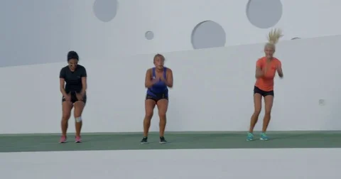 Three Female Aerobics Instructors Taking a Class Video stock 79823290
