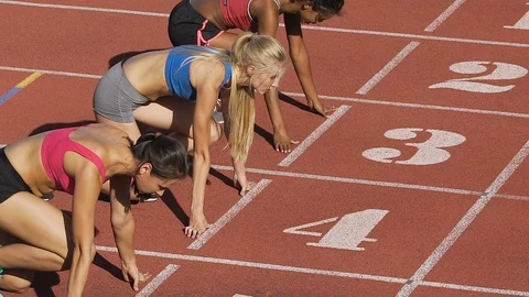 Three female athletes simultaneously start running marathon, rivalry, slow-mo Stock Footage 84987322