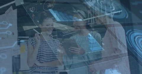 Three female colleagues rotating tablet in office, activating schematic overlay Stock Footage 331701467