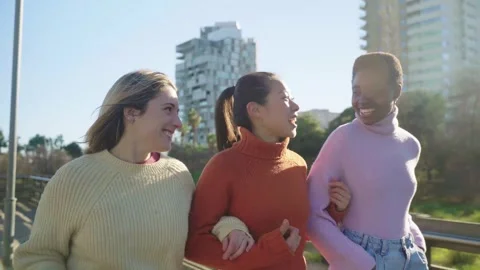 Three female friends having fun together walking and laughing. Stock-Footage 292896602