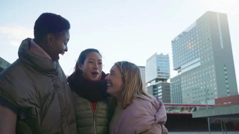 Three female friends having fun together celebrating and laughing. 動画素材 292898775