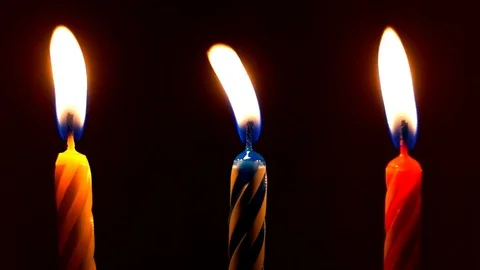 Three festive candles burns in the dark 動画素材 82364317