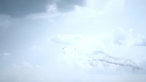 Three fighter jets in the blue sky. A general plan. Aerobatic figures. Airshow Stock Footage 124145998