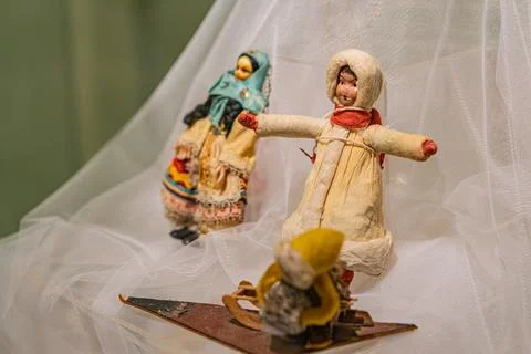 Three figurines on white background with lace details, representing religio.. Stock Photos