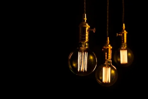 Three filament light bulbs with copy space Stock Photos
