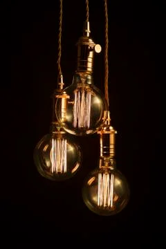 Three filament light bulbs Stock Photos