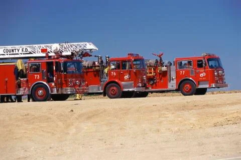 Three fire engines parked side-by-side Stock Photos