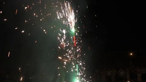 Three fire show performers standing in fire circle, performing. One juggles Video stock 101047977